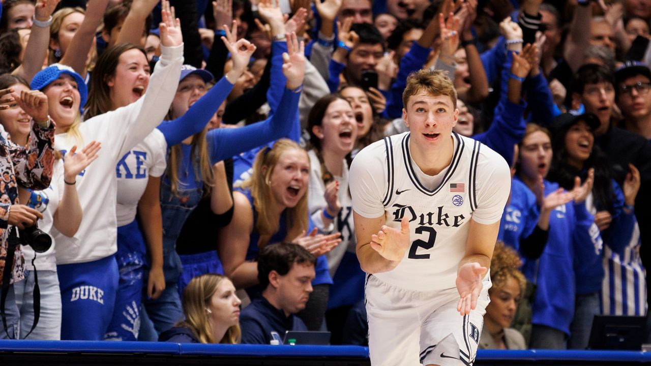 Duke's Cooper Flagg (2) reacts after hitting a 3-pointer during the first half of an NCAA college basketball game against Notre Dame in Durham, N.C., on Saturday, Jan. 11, 2025. (AP Photo/Ben McKeown)