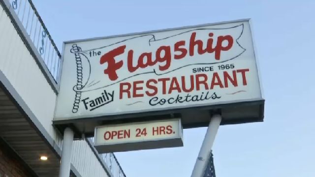 A white sign says, "The Flagship Family Restaurant."