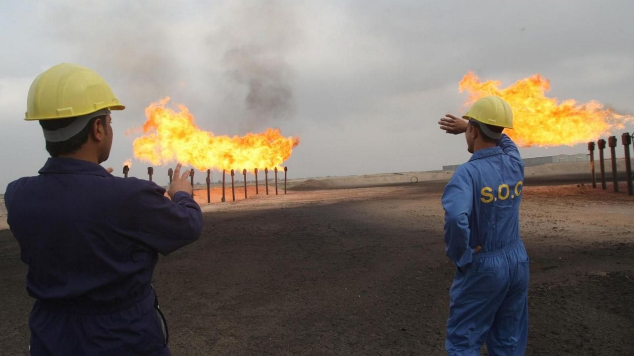 Oil and gas flaring spews methane and other poisonous, volatile gasses into the air at the end of a pipe that funnels the gas into a flame. (Image by Getty Images)