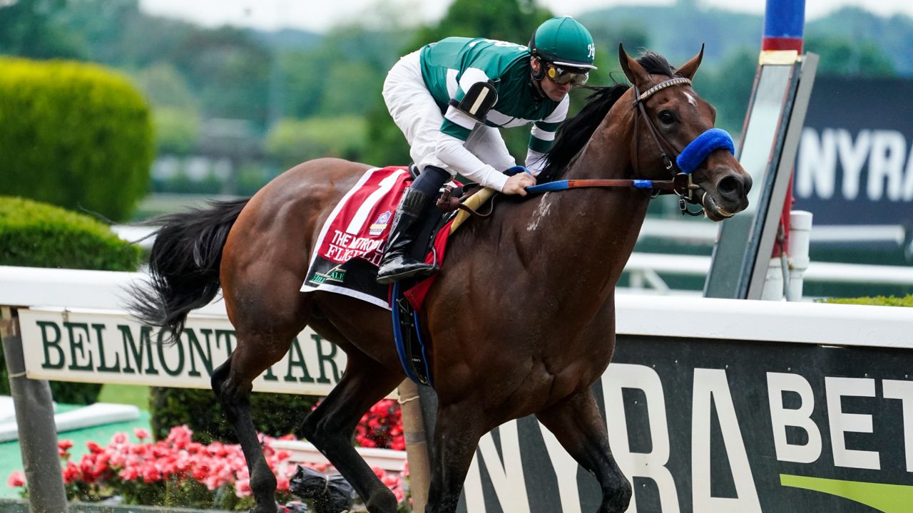 Flightline, jockey Flavien Prat up, wins The Hill 'N' Dale Metropolitan horse race before the 154th running of the Belmont Stakes horse race, Saturday, June 11, 2022, at Belmont Park in Elmont, N.Y. Undefeated Flightline and Rich Strike, upset winner of the Kentucky Derby, head a field of nine for the Breeders' Cup Classic. (AP Photo/John Minchillo)