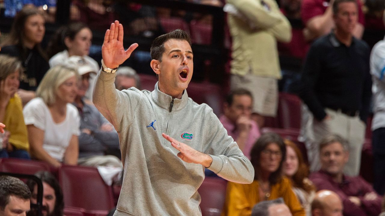 Florida head coach Todd Golden shouts instructions to his team against Florida State in the second half of an NCAA college basketball game in Tallahassee, Fla., Friday, Nov. 15, 2024. (AP Photo/Mark Wallheiser)