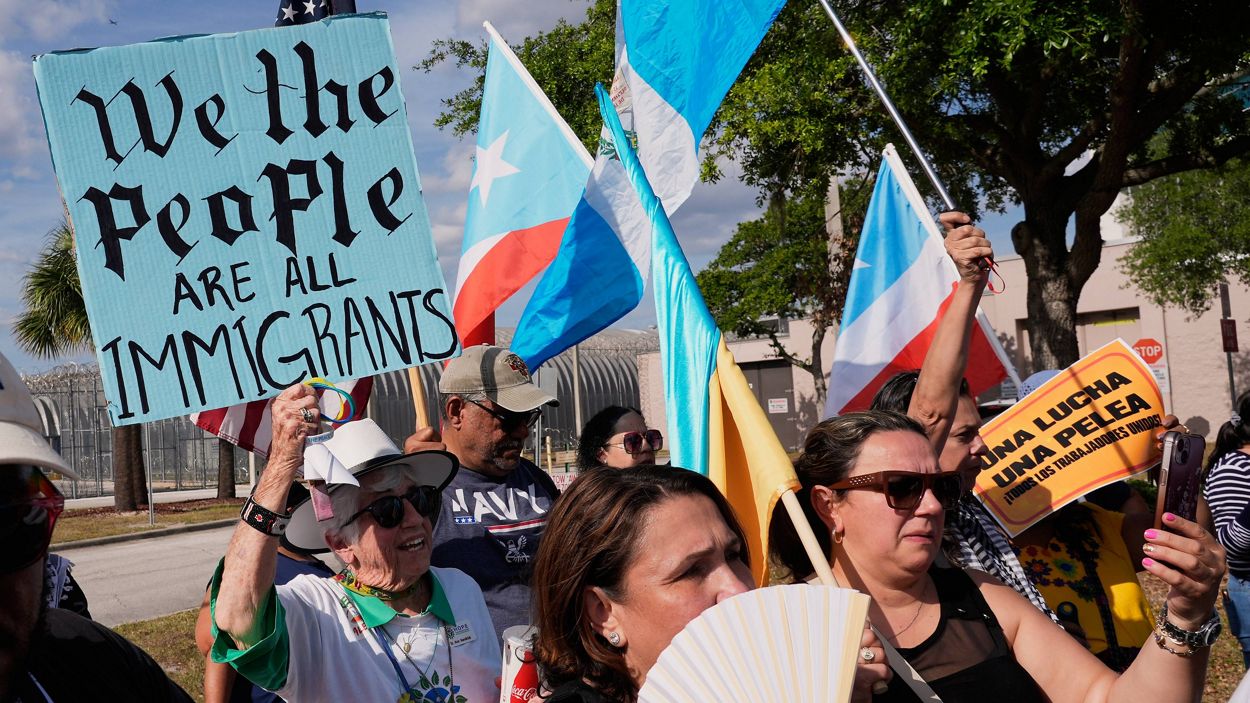 Demonstrators gather in Orlando, Florida, for a May Day rally supporting immigrant rights.