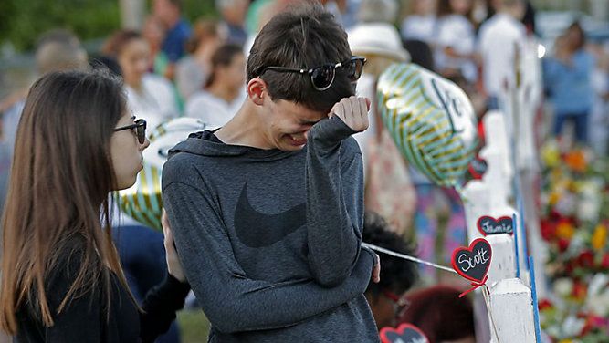 Students grieve following a mass shooting at Marjory Stoneman Douglas High School in Parkland Florida. (AP/File)