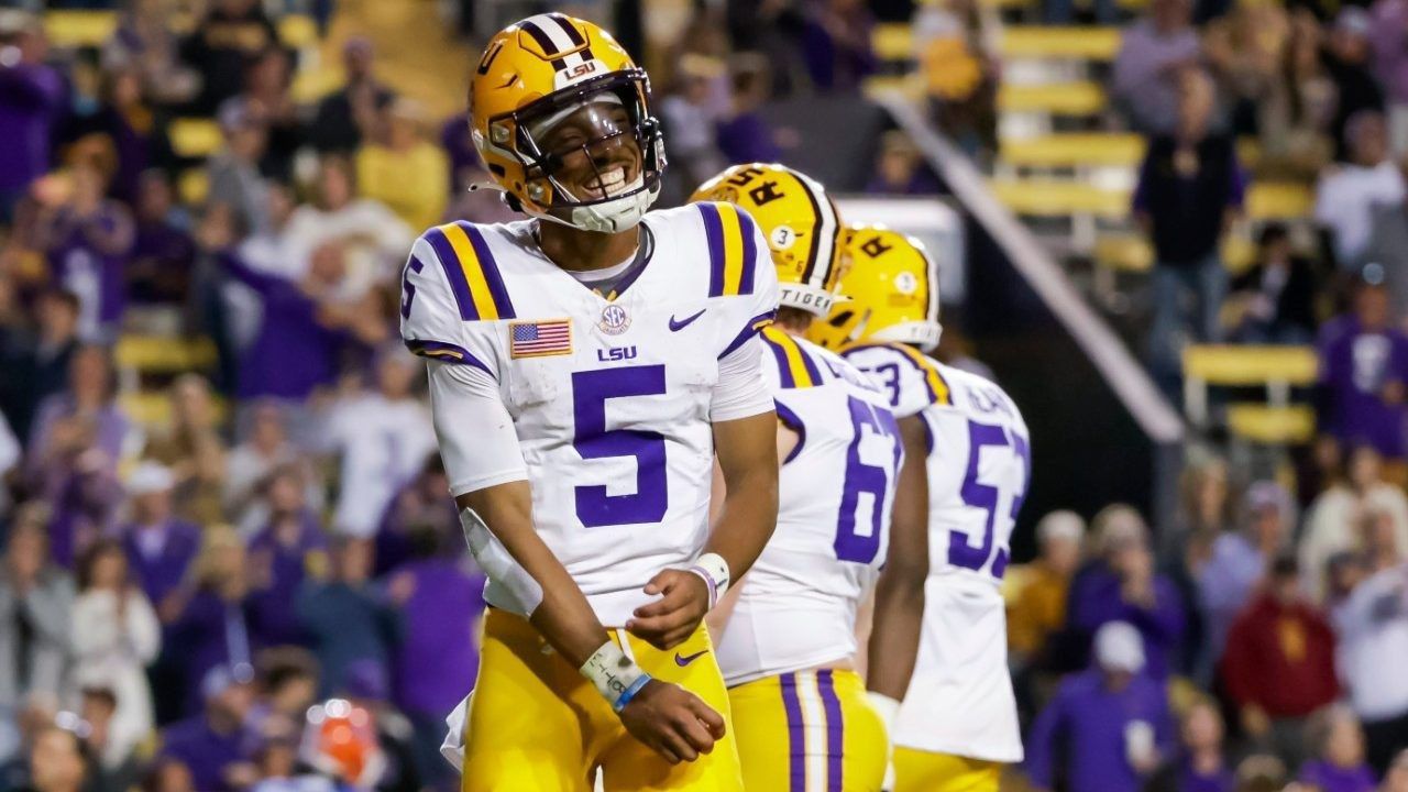 LSU quarterback Jayden Daniels (5) smiles after a touchdown against Florida during the second half of an NCAA college football game in Baton Rouge, La., Saturday, Nov. 11, 2023. (AP Photo/Derick Hingle)