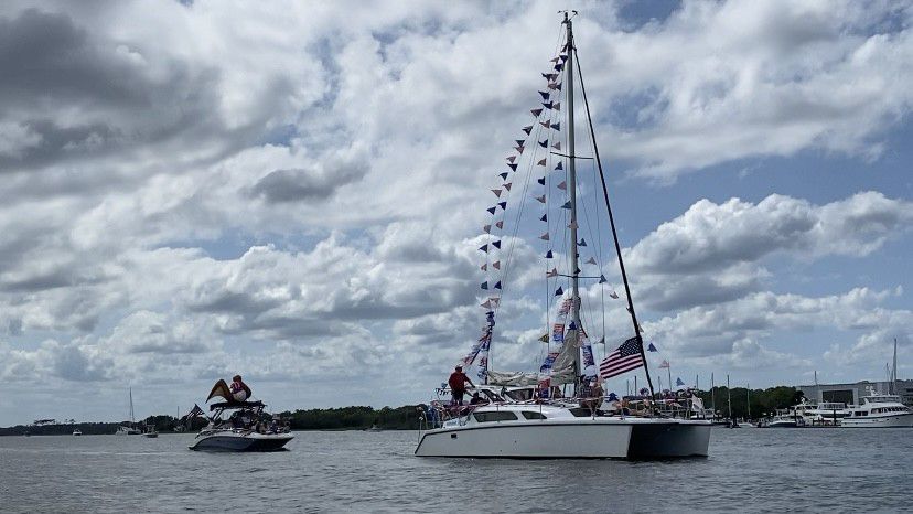 Boats decked out in red, white and blue make their way down the Intracoastal Waterway. (Spectrum News 1/Natalie Mooney)
