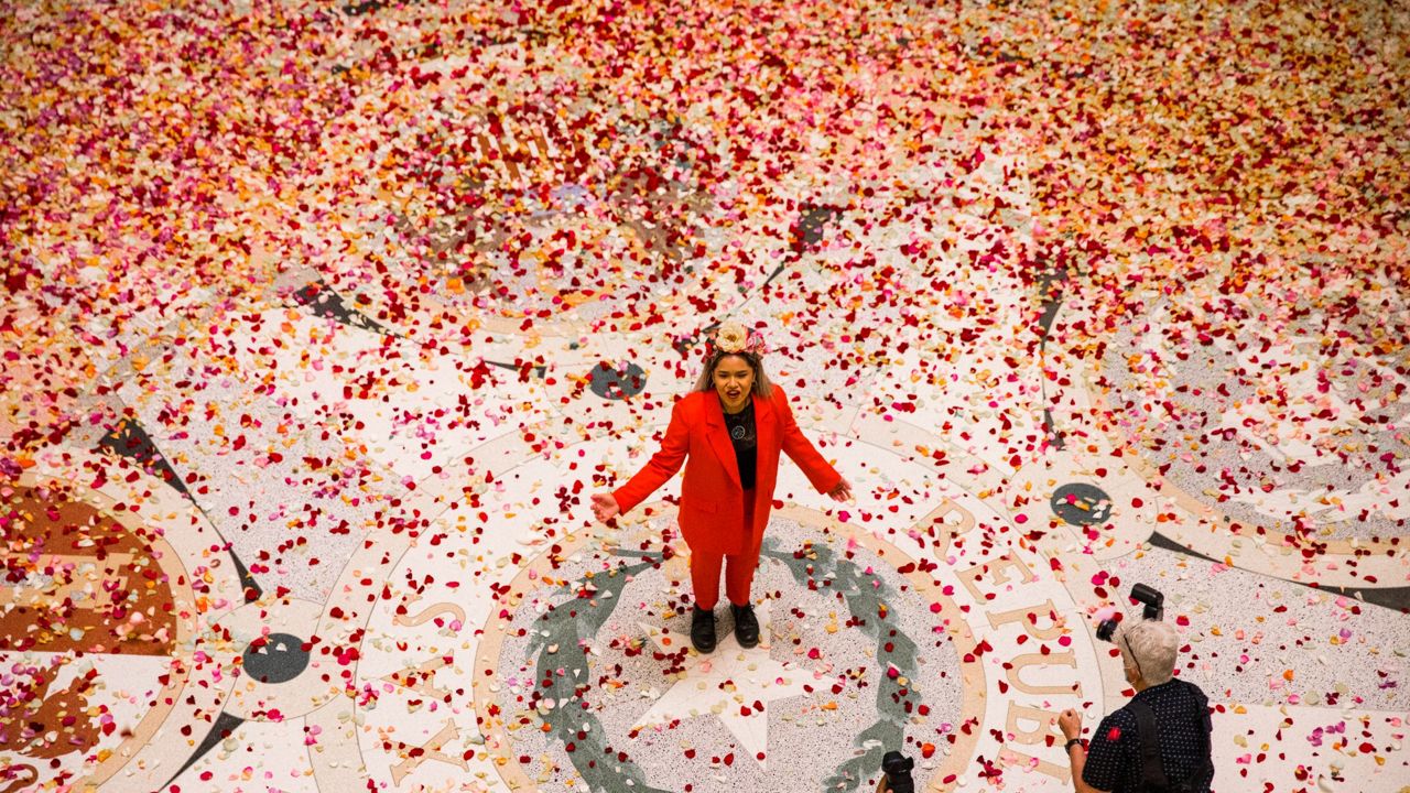 A woman sang "Amazing Grace" as 250,000 rose pedals fell to the floor of the State Capitol's rotunda. (Photo courtesy of Jolt Action.)