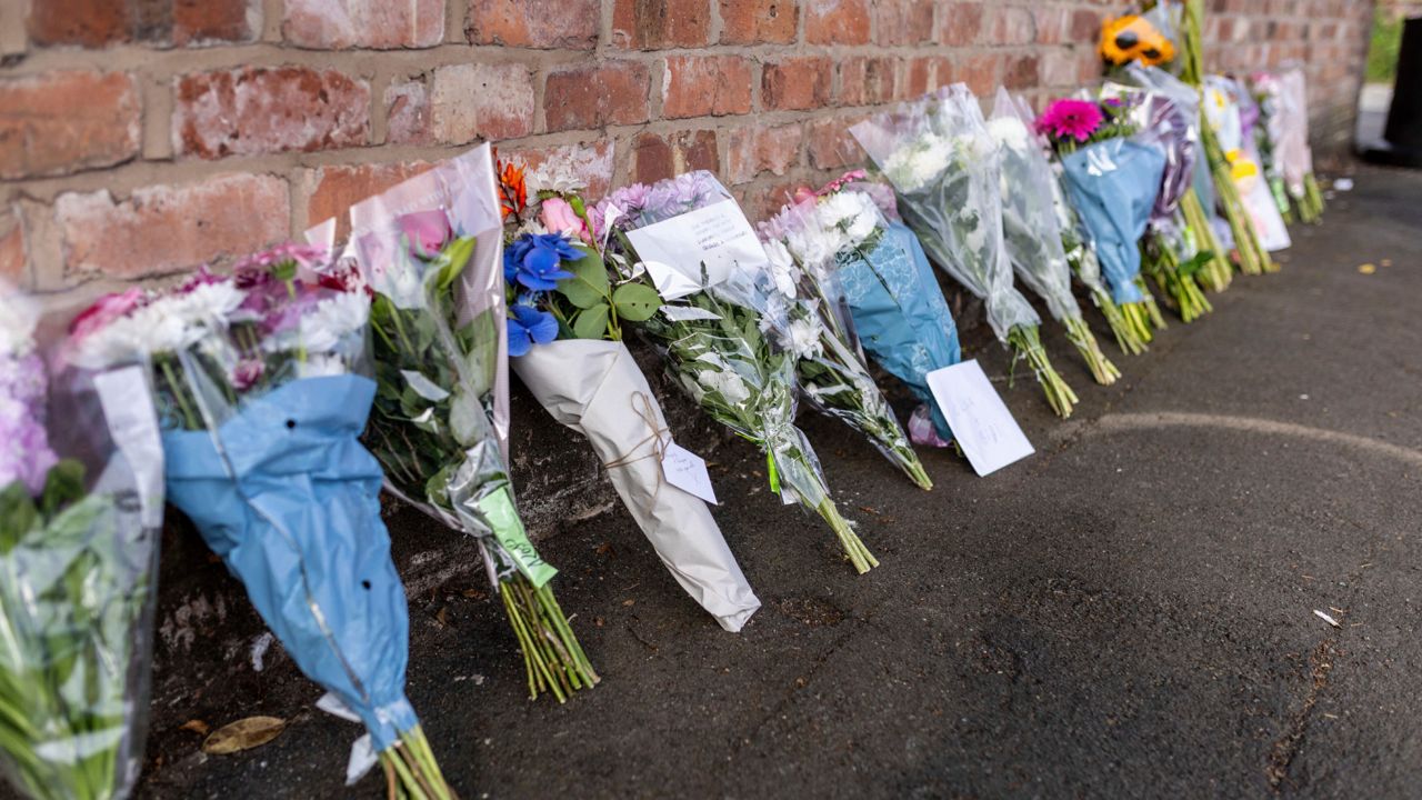 Floral tributes near the scene in Hart Street, Southport, Britain, on Tuesday, where two children died and nine were injured in a "ferocious" knife attack during a Taylor Swift event at a dance school on Monday. (James Speakman/PA via AP)