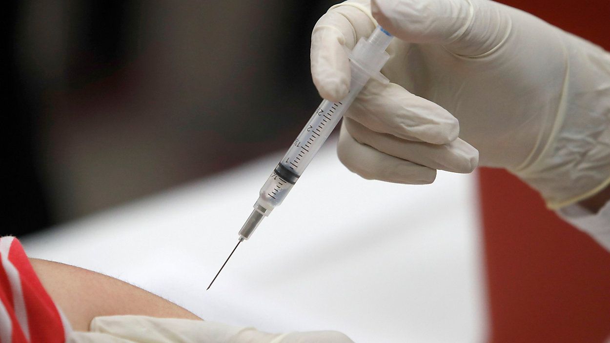 In this Thursday, Jan. 23, 2020 file photo, a patient receives an influenza vaccine in Mesquite, Texas. (AP Photo/LM Otero)