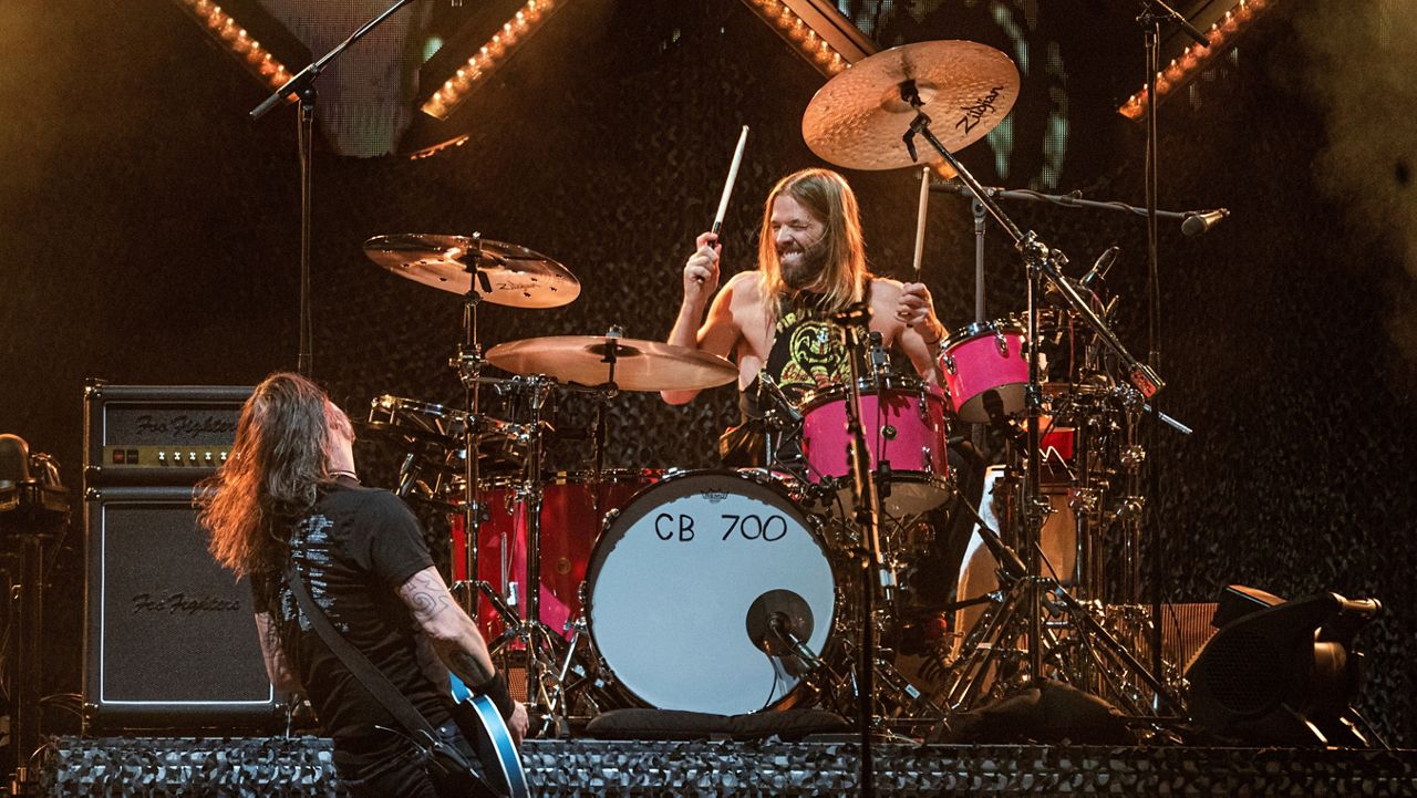 Dave Grohl, left, and Taylor Hawkins of the Foo Fighters perform at the Innings Festival at Tempe Beach Park on Saturday, Feb. 26, 2022, in Tempe, Ariz. (Photo by Amy Harris/Invision/AP)