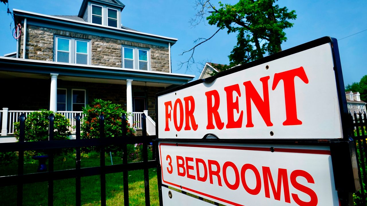 A sign indicating the availability of a home to rent stands outside a building in Philadelphia on Wednesday, June 22, 2022.