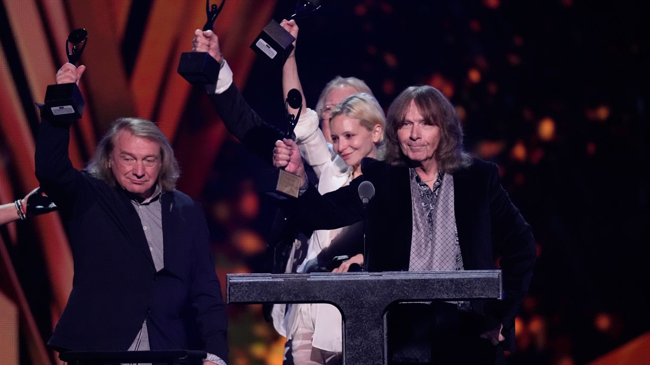 Lou Gramm, from left, Rick Wills , Alexandra Dexter-Jones, daughter of Mick Jones, and Al Greenwood of Foreigner speak during the 39th Annual Rock & Roll Hall of Fame Induction Ceremony on Saturday, Oct. 19, 2024, at Rocket Mortgage FieldHouse in Cleveland. 