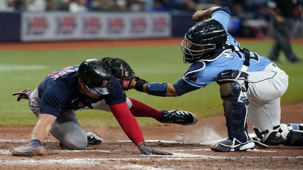 Hunter Renfroe of the Boston Red Sox breaks a baseball hat over