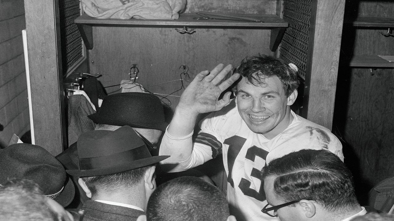 Cleveland Browns quarterback Frank Ryan gestures in the dressing room as he talks with reporters after the Browns defeated the Indianapolis Colts 27-0 in the NFL championship football game in Cleveland, Ohio, Dec. 27, 1964. 