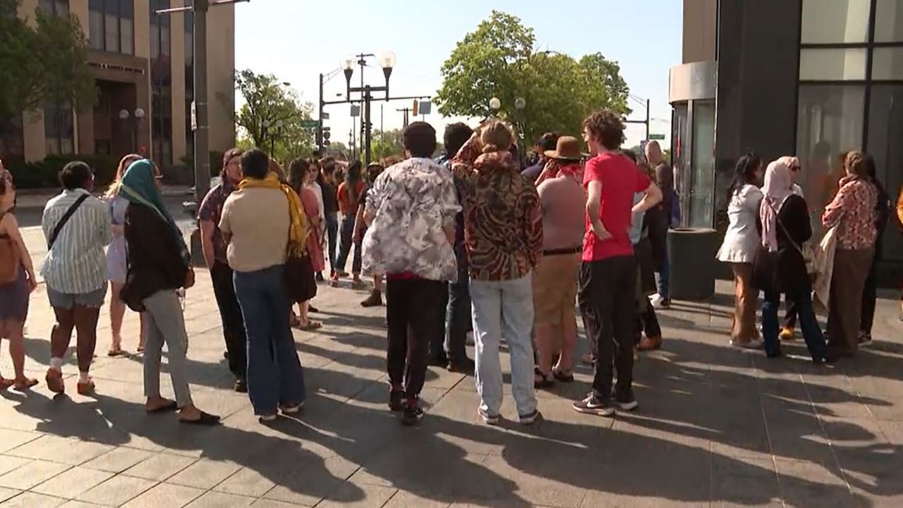 Community members gather outside Franklin County Courthouse to show support to the protesters who were arrested during last week's protests on Ohio State's campus. (Spectrum News 1/Jamilah Muhammad)