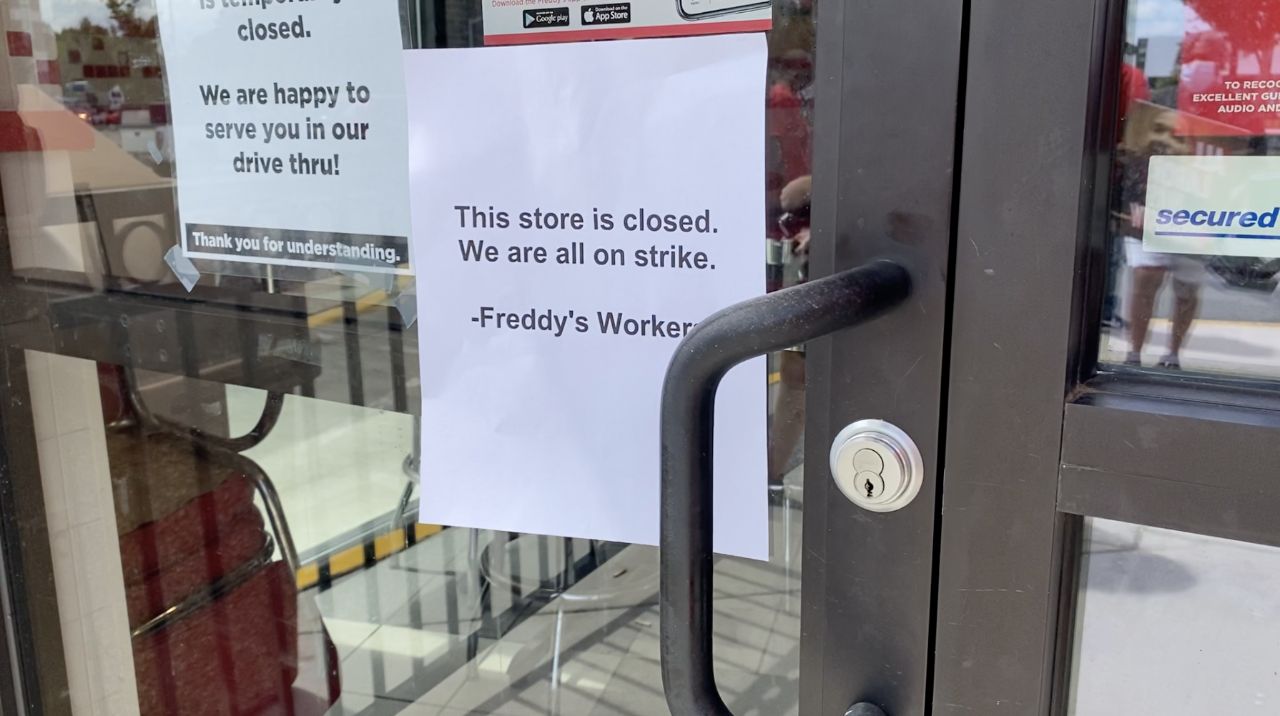 Freddy's workers posted this sign on the door on Friday as they walked off the job.