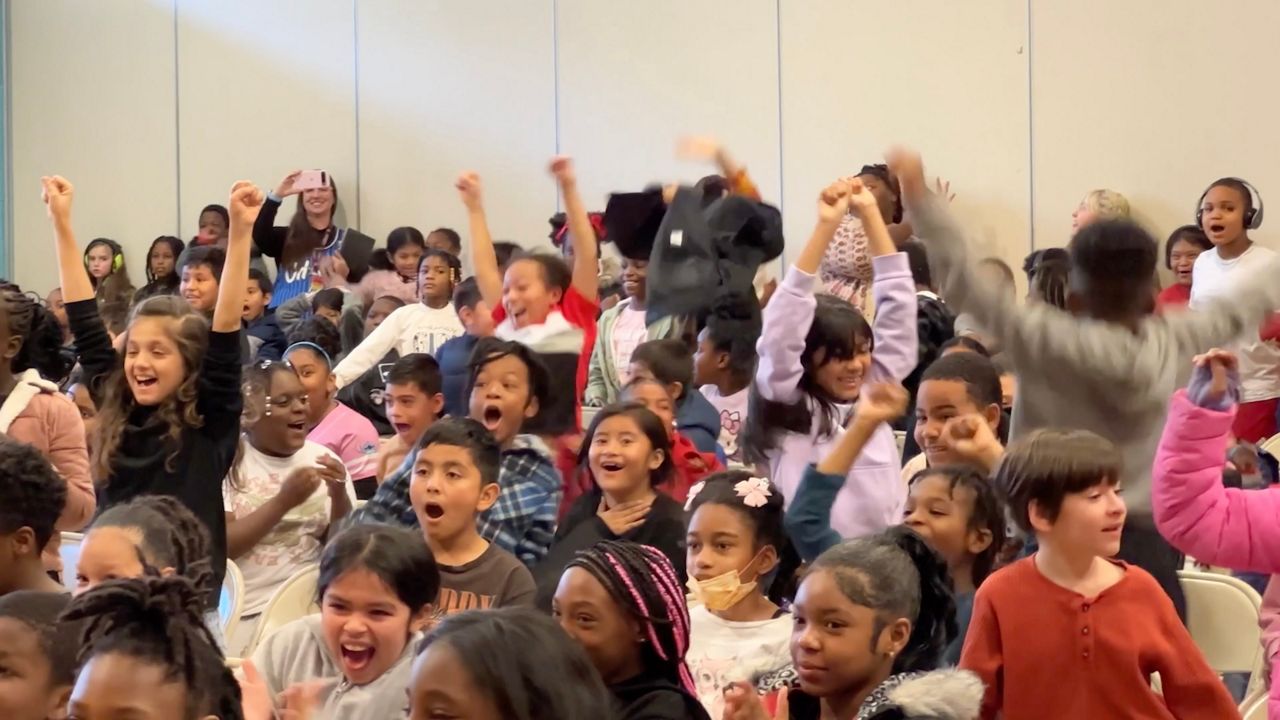 Students were shocked when Triangle Spokes Group announced free bikes for everyone. (Jenna Rae Gaertner/Spectrum News 1)