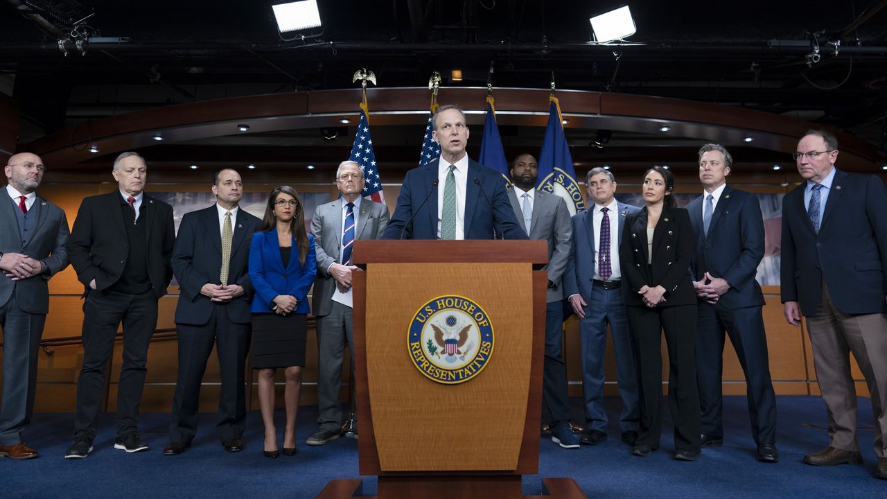 Rep. Scott Perry, R-Pa., center, and members of the House Freedom Caucus speak at the Capitol in March. (AP Photo/J. Scott Applewhite)