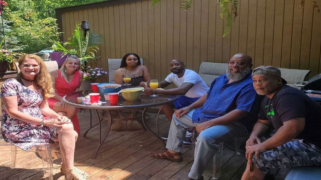 Tamar Evans (third from right) celebrates his freedom at a shower provided by his attorney on July 4. (Photo provided by Kimberly Kendall Corrall)