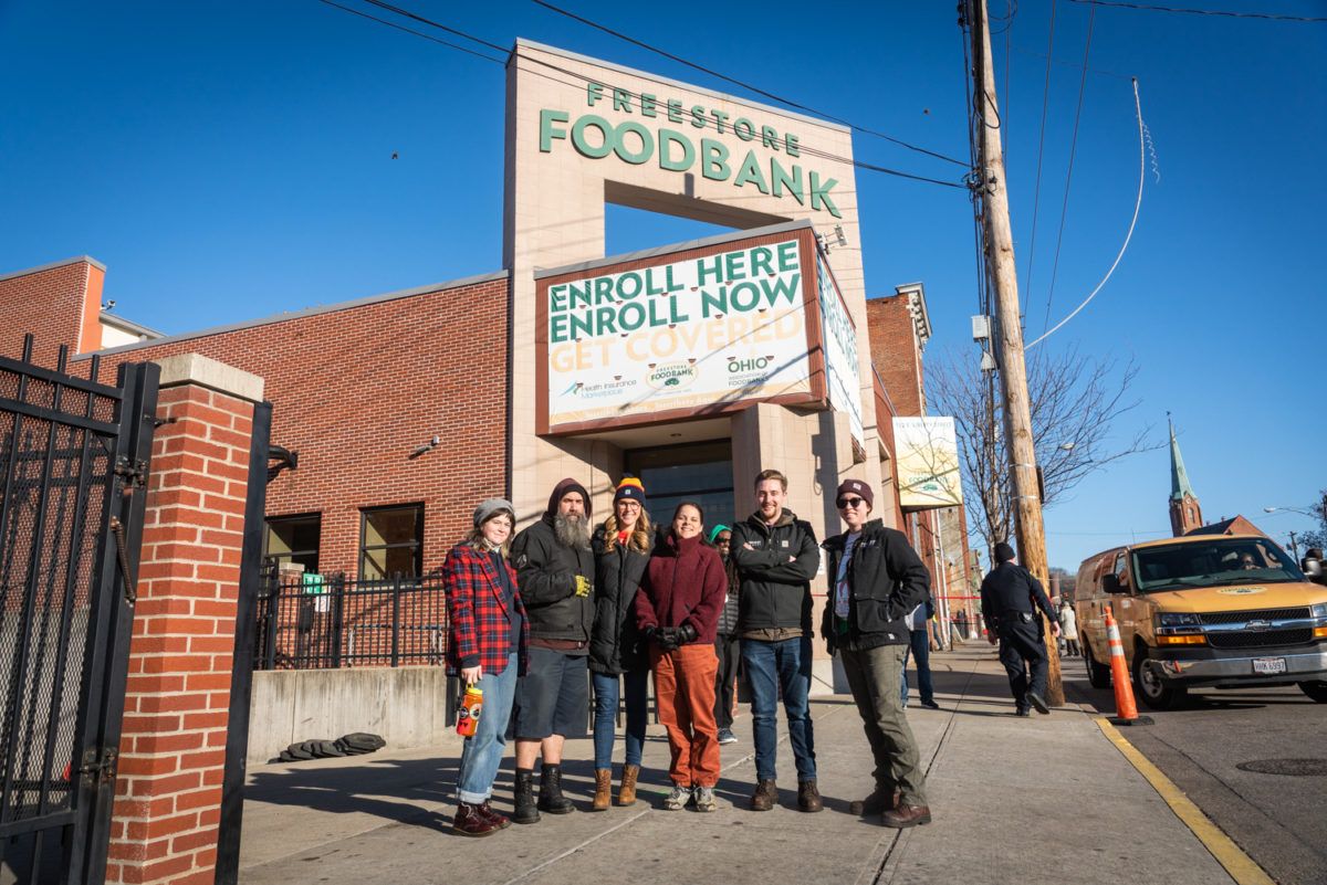 Rhinegeist Brewery staff pose for a photo outside Freestore Foodbank. (Photo courtesy of Rhinegeist Brewery)