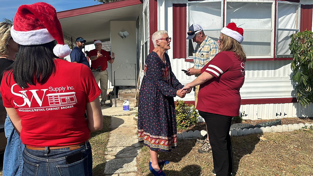 Community rebuilds home for retired nurse after fire