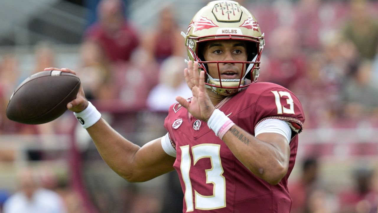 Florida State quarterback Jordan Travis (13) warms up before an NCAA college football game against Syracuse, Saturday, Oct. 14, 2023, in Tallahassee, Fla. (AP Photo/Phelan M. Ebenhack)