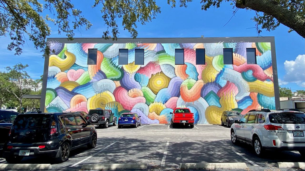Art bathes the wall of St. Pete, beckoning visitors