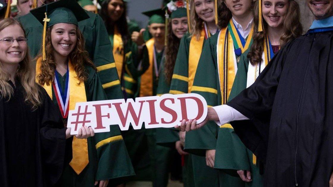 Graduating Fort Worth ISD students pose before walking into their ceremony. (Courtesy of FWISD.
