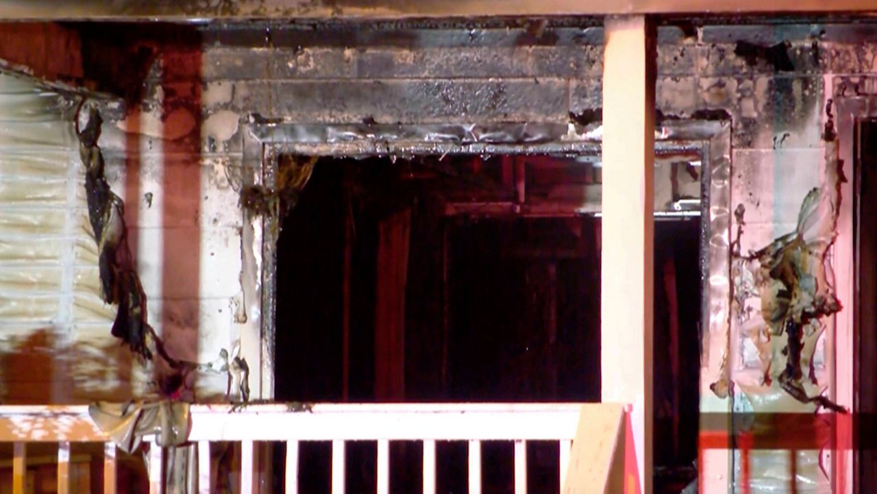 This image taken from video provided by WLNE-TV shows damage from a fire at an assisted living facility in Fall River, Mass., Sunday, July 13, 2025. (WLNE-TV via AP)