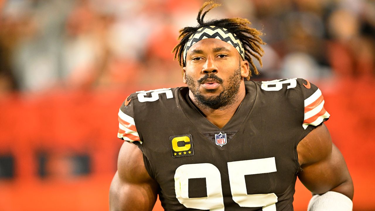 Cleveland Browns defensive end Myles Garrett (95) pressures Tennessee Titans quarterback Ryan Tannehill, left, during the first half of an NFL football game Sunday, Sept. 24, 2023, in Cleveland. (AP Photo/David Richard)