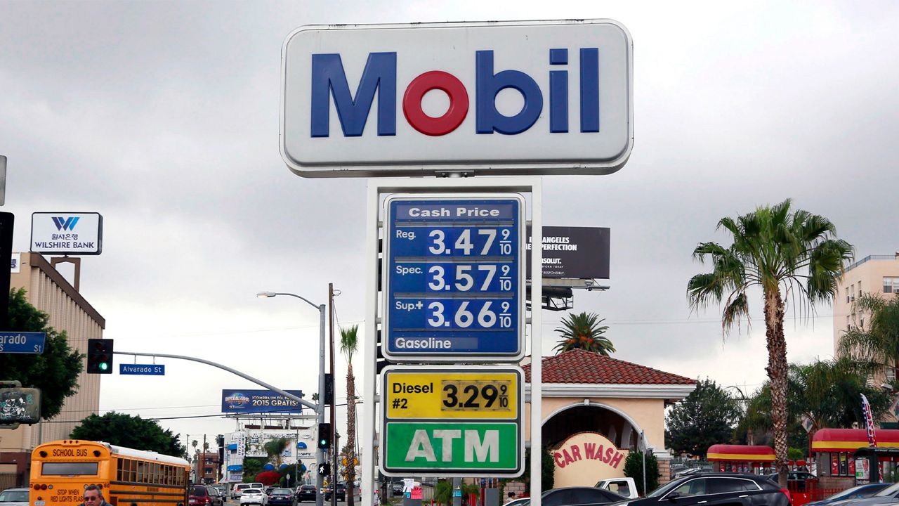 A cyclist rides by a sign at a gas station in Los Angeles posting the latest gas prices on Friday, Feb. 27, 2015. Gas prices in California soared overnight as a result of a combination of supply-and-demand factors worsened by the shutdown of two refineries that produce a combined 16 percent of the state’s gasoline. (AP Photo/Nick Ut)