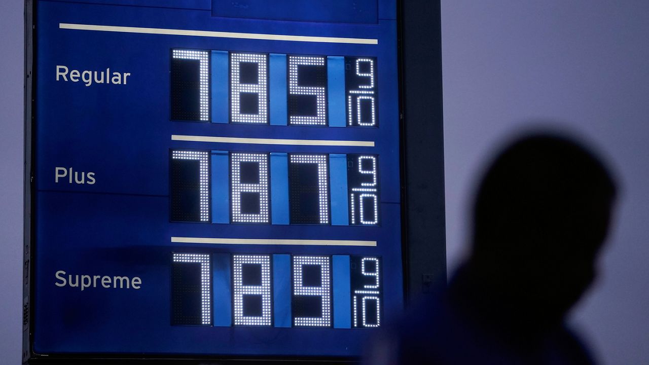 High gas prices are shown as a pedestrian waits to cross the street in Los Angeles, June 16, 2022. (AP Photo/Jae C. Hong, File)