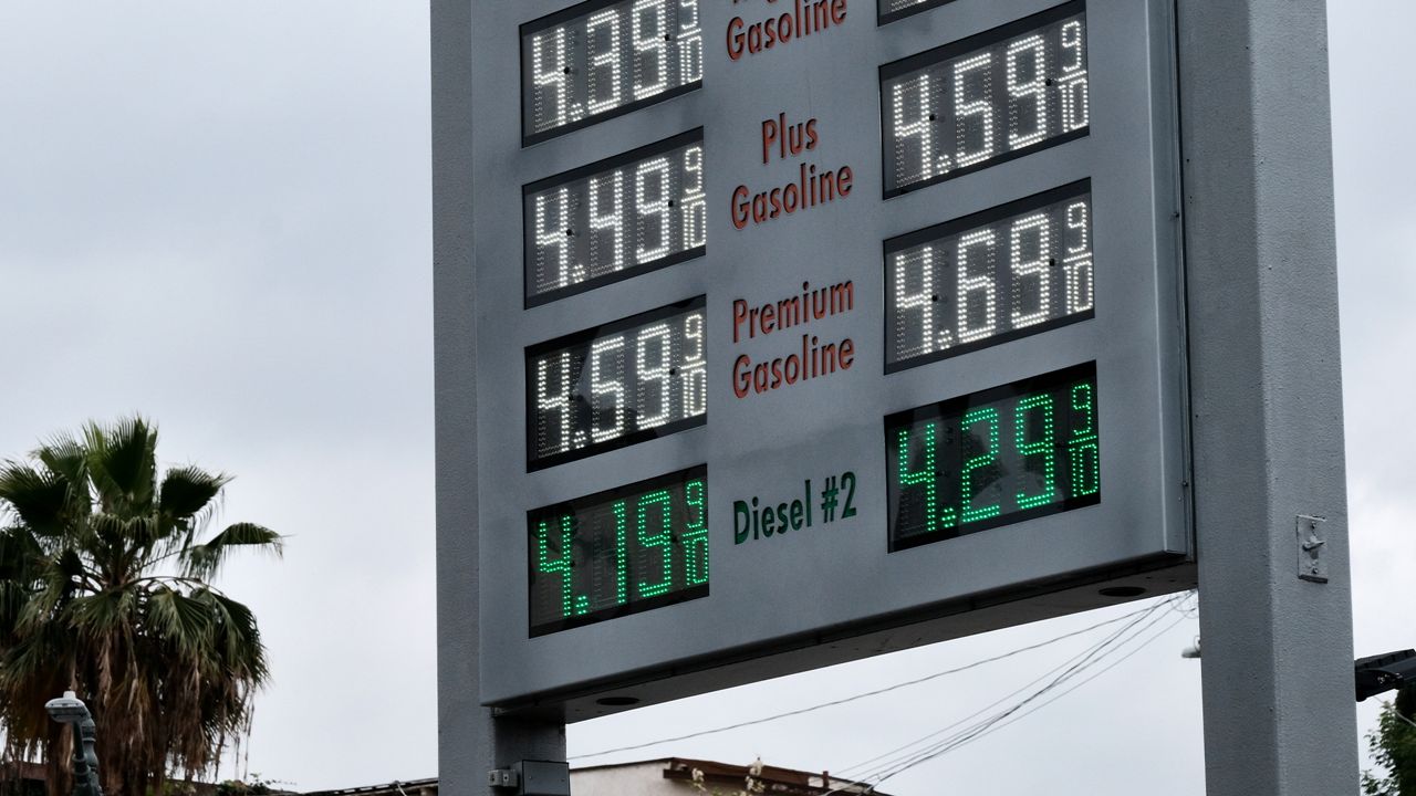 Gasoline prices are displayed at a gas station near downtown Los Angeles on Friday, May 18, 2018. Tax cuts have also left most U.S. households with more money to spend, though that extra cash has been eroded in recent weeks by sharply higher gasoline prices. (AP Photo/Richard Vogel)