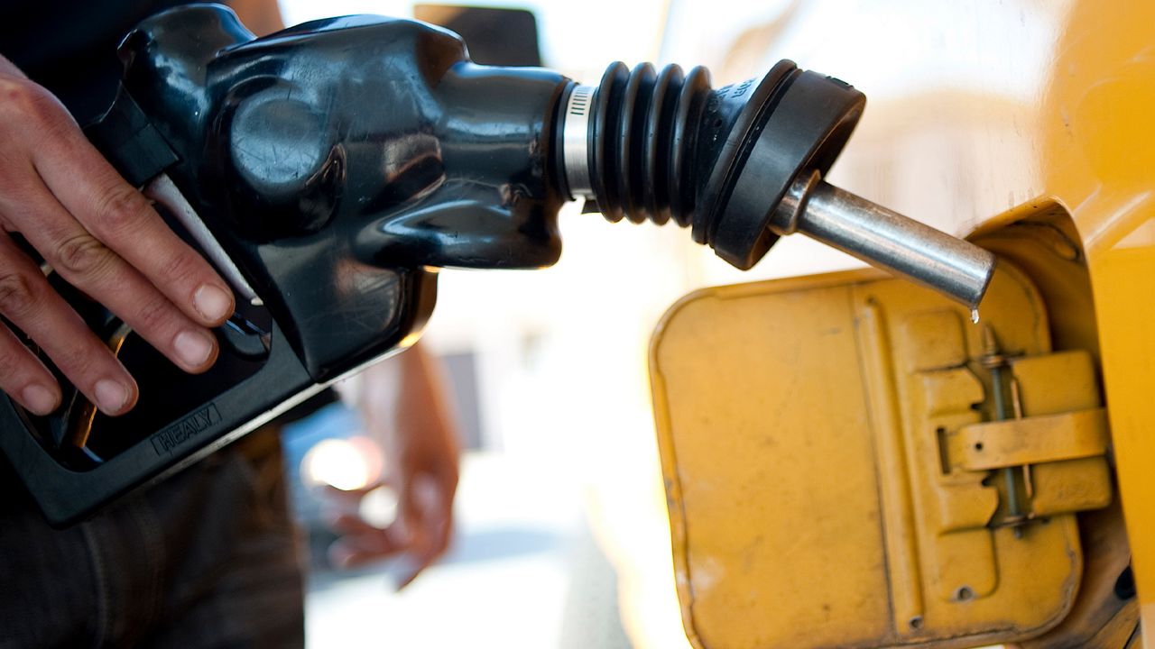 A man pumps gas into his dual-tank pickup truck at a 76 gas station in Los Angeles, Friday, Aug. 10, 2012. Analysts expect gas prices to rise above $4 a gallon due to a fire at the Richmond, Calif., refinery on Aug. 6, 2012. (AP Photo/Grant Hindsley)