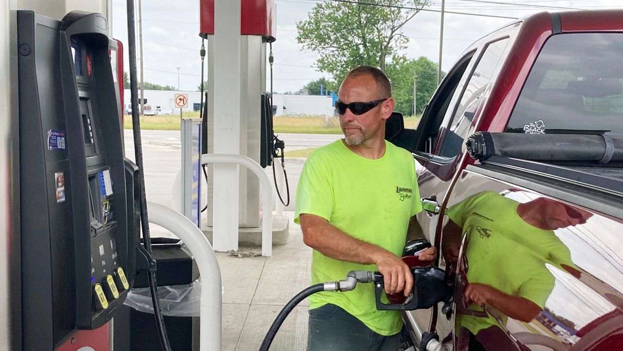 Pat Blevins fills the tank of his 2016 Chevrolet Silverado on Tuesday at a gas station in Sylvania Township, Ohio. (AP Photo/Tom Krisher)