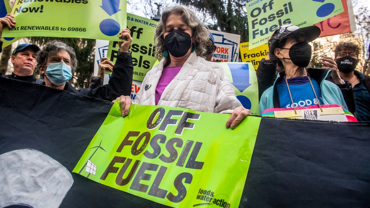 Climate activists from the #GasFreeNYC coalition and elected officials rally in City Hall Park on Wednesday, Dec. 15, 2021, in New York. (AP Photo/Brittainy Newman)