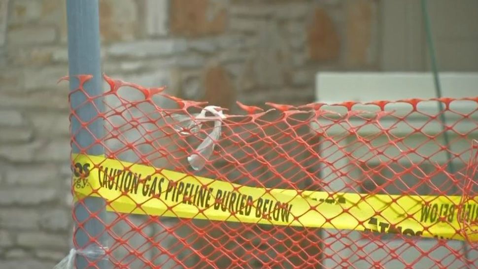 An area around the gas leak is blocked off with tape and red netting. (Spectrum News footage)