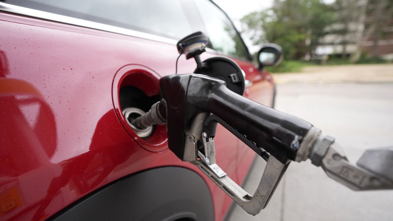 A motorist fills up the tank of a vehicle at a Shell station Wednesday, July 5, 2023, in Englewood, Colo. (AP Photo/David Zalubowski)