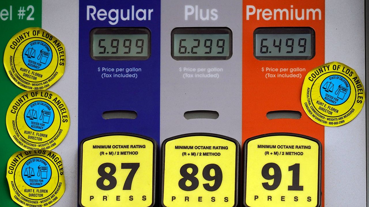 High gas prices are posted at a full-service gas station in Beverly Hills, Calif., on Sunday. (AP Photo/Damian Dovarganes)
