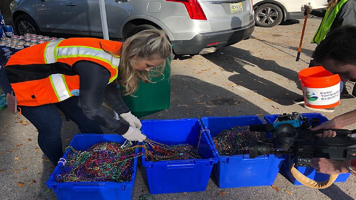 Gasparilla clean up continues well after the parade. There's no shortage of left over beads along Bayshore, on sidewalks, in the water and even in trees. (Spectrum News image)