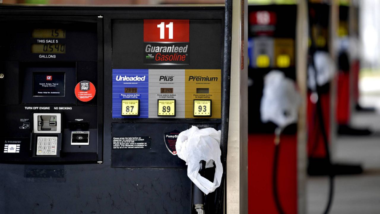 A QuickTrip convenience store has bags on their pumps as the station has no gas, Tuesday, May 11, 2021, in Kennesaw, Ga. Colonial Pipeline, which delivers about 45% of the fuel consumed on the East Coast, halted operations last week after revealing a cyberattack that it said had affected some of its systems. (AP Photo/Mike Stewart)