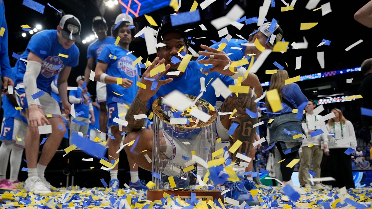 Florida guard Alijah Martin and team celebrate victory over Tennessee after an NCAA college basketball game in the final round of the Southeastern Conference tournament, Sunday, March 16, 2025, in Nashville, Tenn. (AP Photo/George Walker IV)