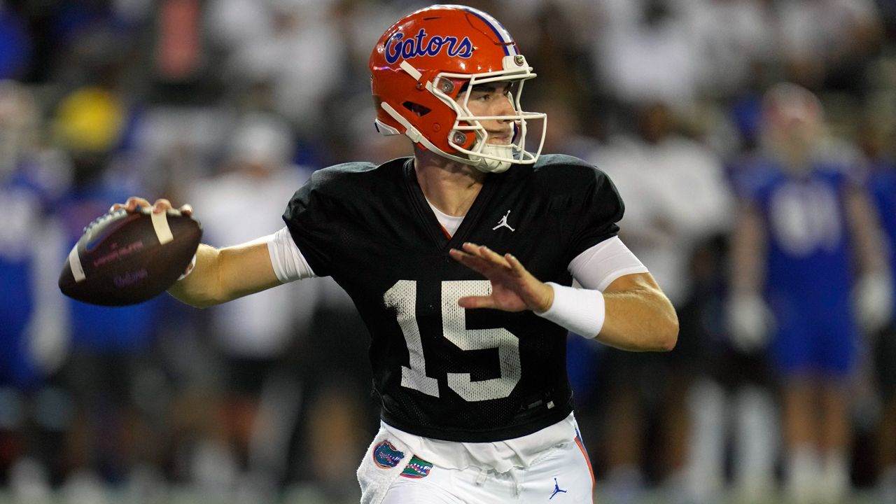 Transfer quarterback Graham Mertz completed 18 of 29 passes for 244 yards and a touchdown in Florida's Orange and Blue spring game in April to help him win the starting job for the Gators season-opener against 14th-ranked Utah on Aug. 31. (AP Photo/John Raoux, File)