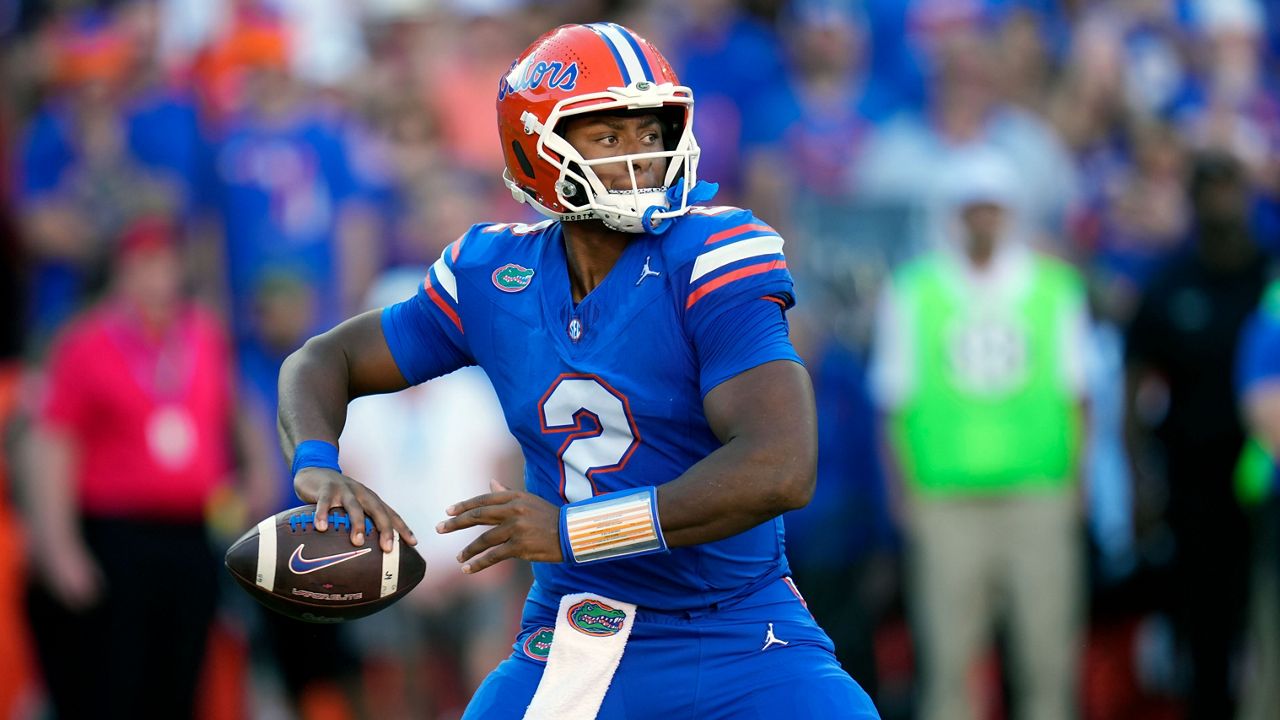 Florida quarterback DJ Lagway looks for a receiver during the first half of an NCAA college football game against LSU, Saturday, Nov. 16, 2024, in Gainesville, Fla. (AP Photo/John Raoux)