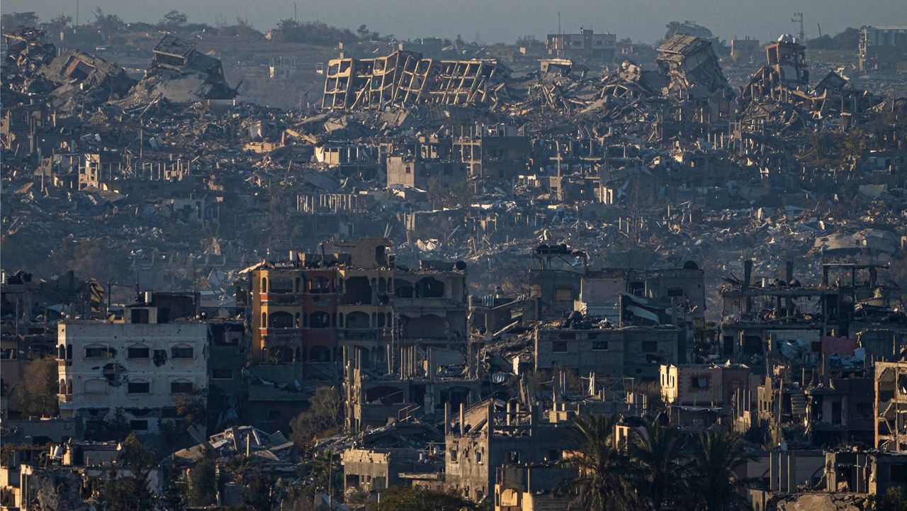 Destroyed buildings are seen inside the Gaza Strip from southern Israel, Monday, Jan. 13, 2025. (AP Photo/Ariel Schalit)