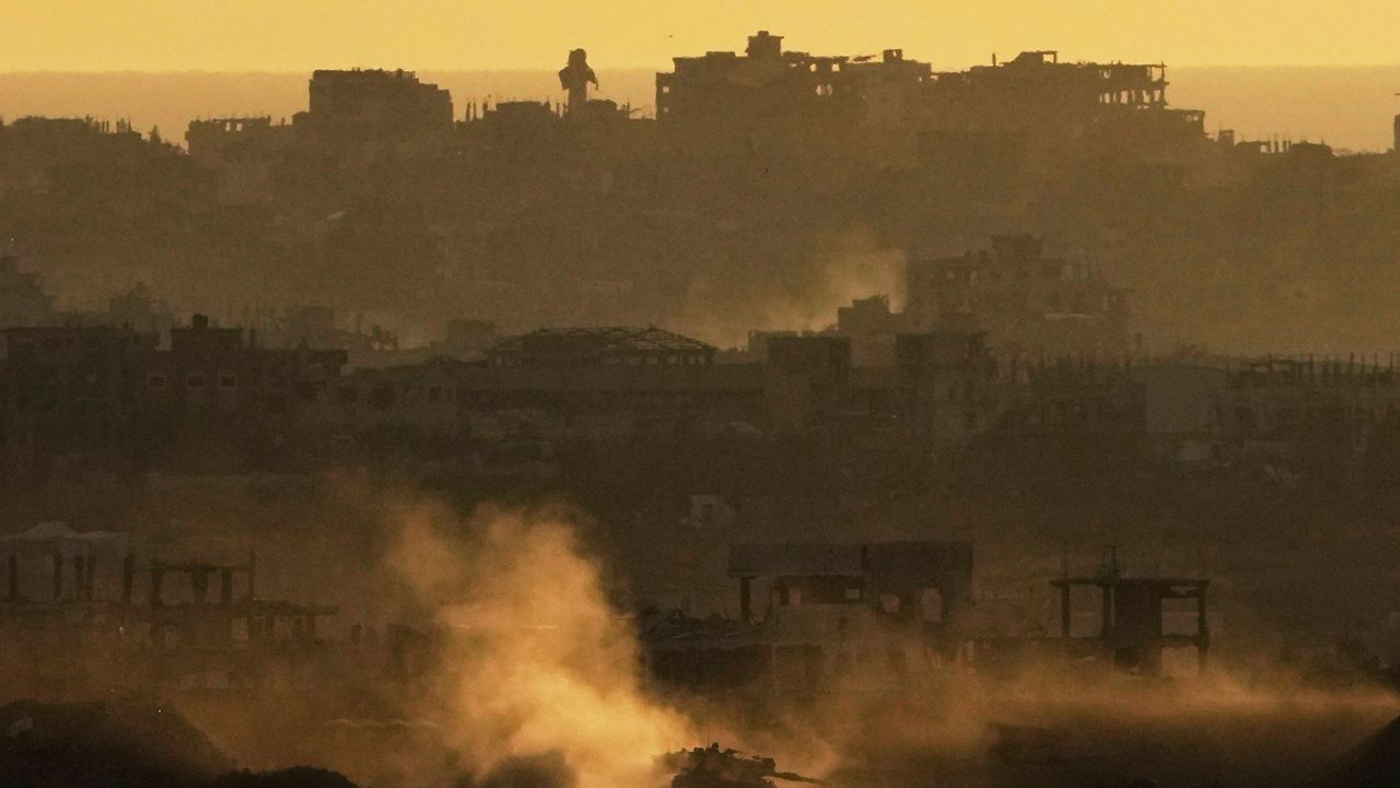 An Israeli army tank maneuvers in the Gaza Strip is seen from southern Israel, Sunday, May 4, 2025. (AP Photo/Ariel Schalit)