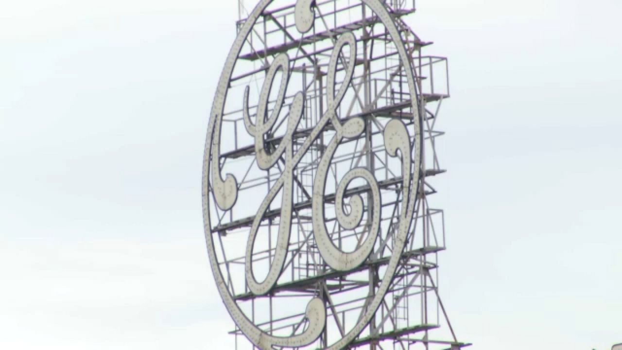 general electric logo over schenectady headquarters on a cloudy day