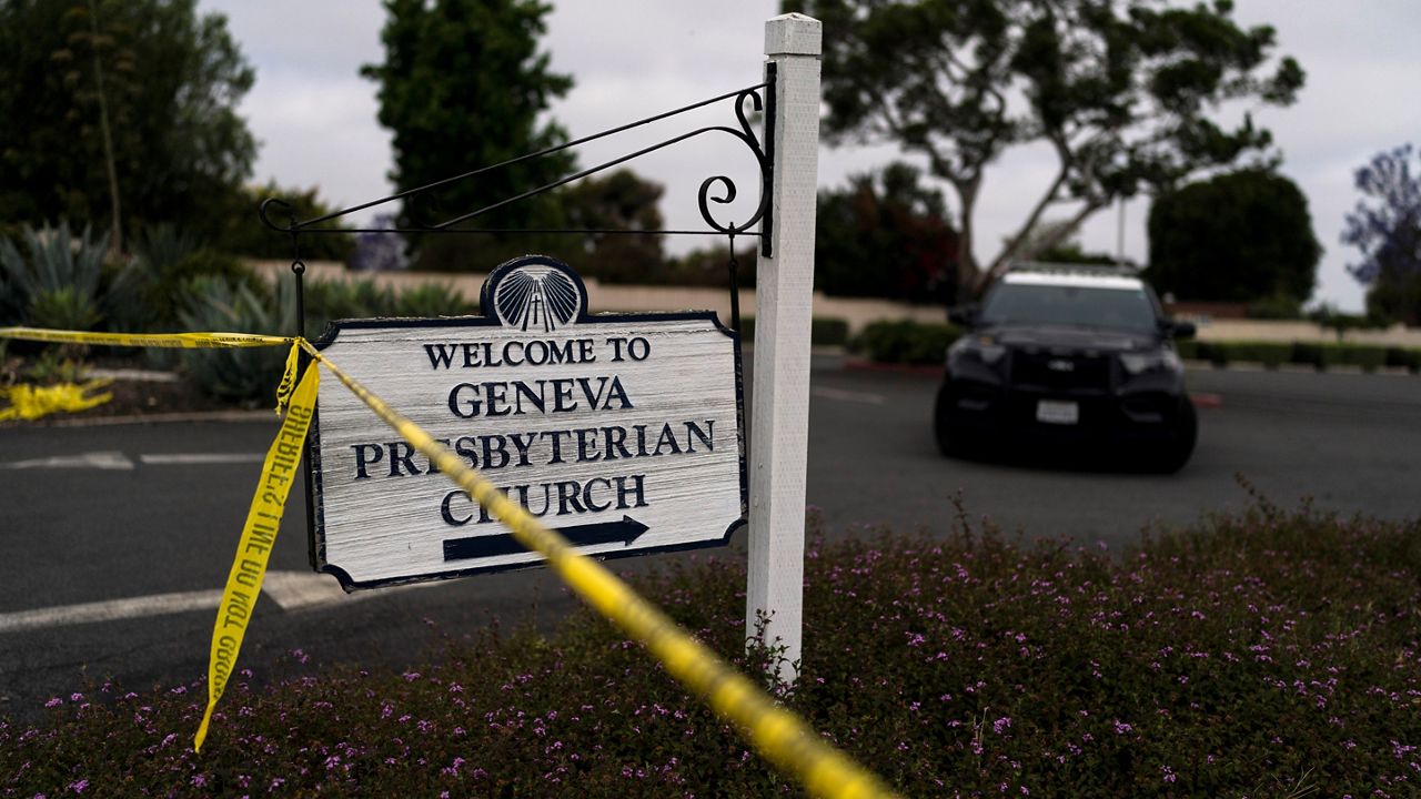 A police tape blocks off the entrance to the parking lot of Geneva Presbyterian Church in Laguna Woods, Calif., Monday, May 16, 2022. (AP Photo/Jae C. Hong)