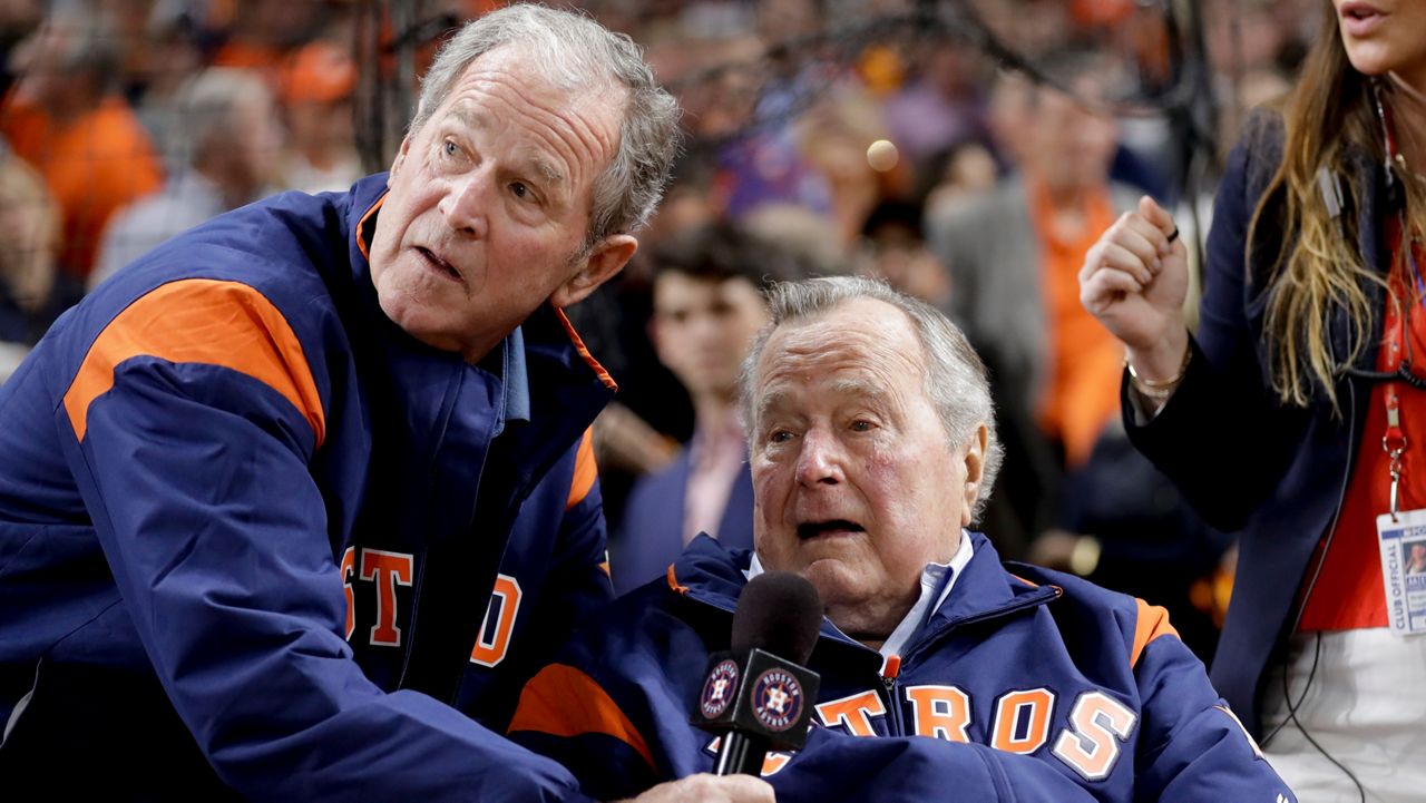 Former President George W. Bush, seen in this file photo with his father, former President George H.W. Bush, will be in Florida later this week. (AP Photo)
