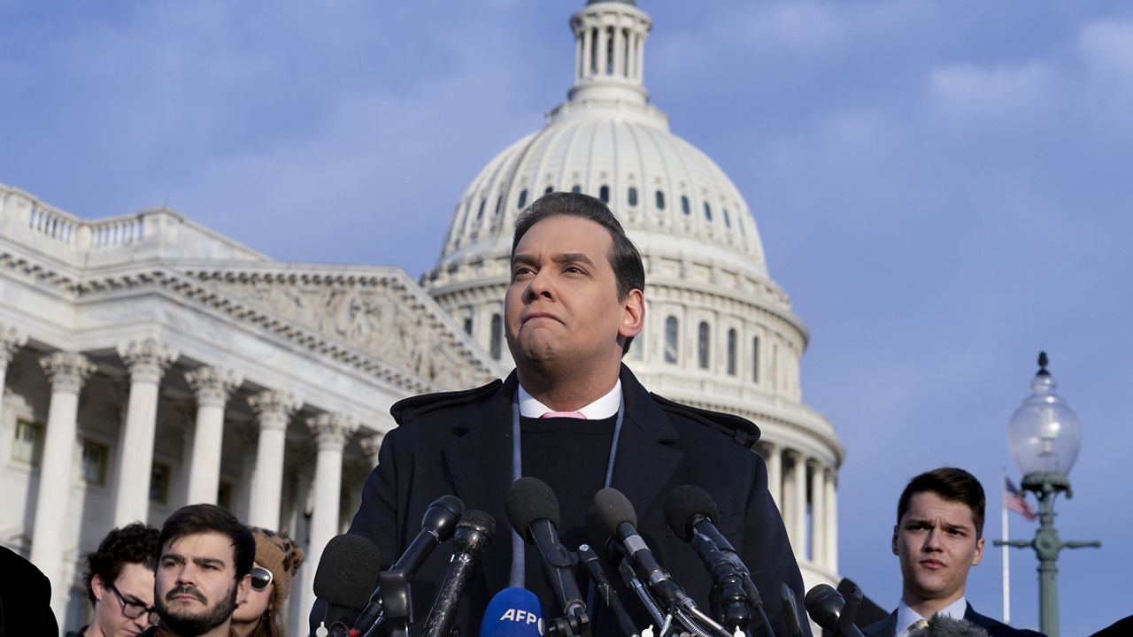 Rep. George Santos, R-N.Y., faces reporters at the Capitol in Washington, Thursday, Nov. 30, 2023. (AP Photo/J. Scott Applewhite)