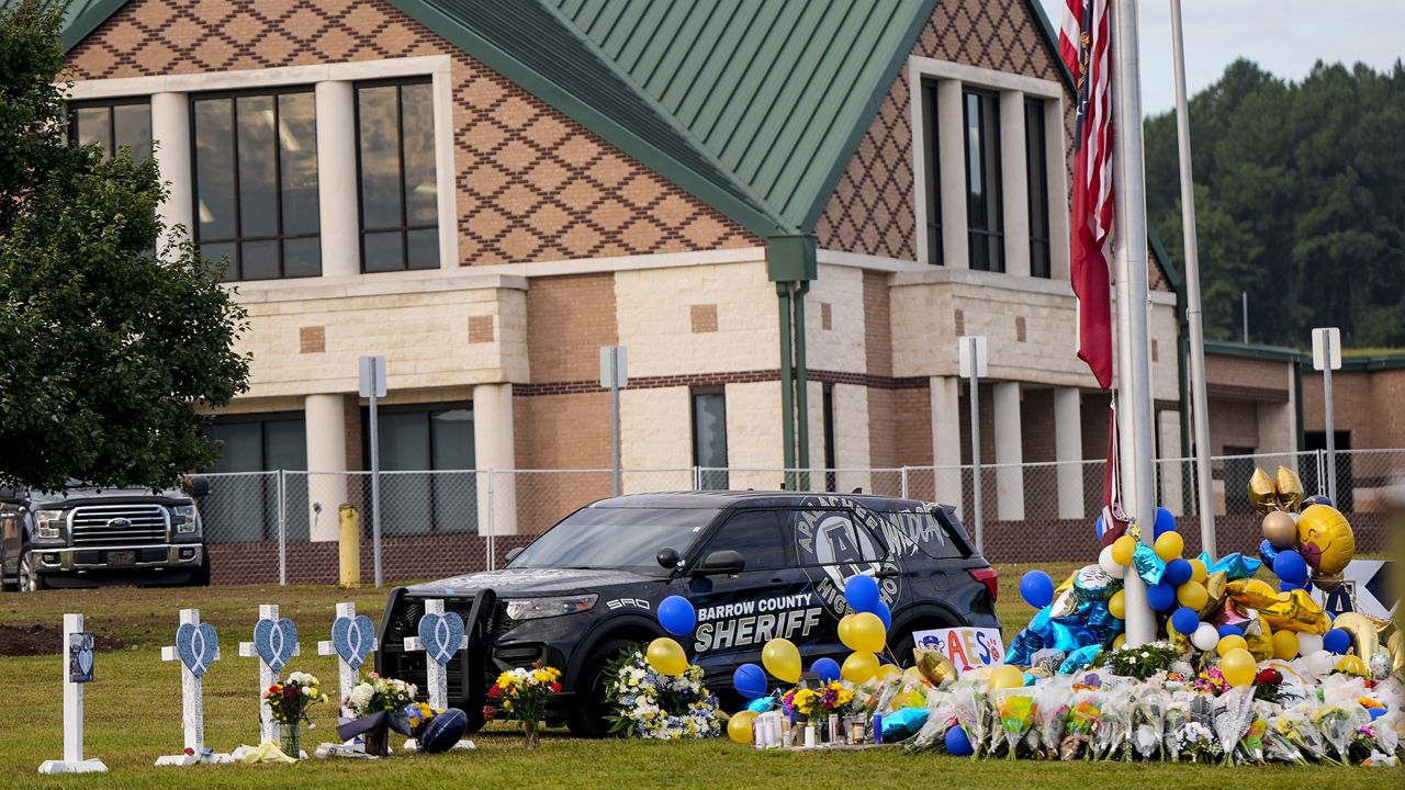 A memorial is seen at Apalachee High School after the Wednesday school shooting, Saturday, Sept. 7, 2024, in Winder, Ga. (AP Photo/Mike Stewart)